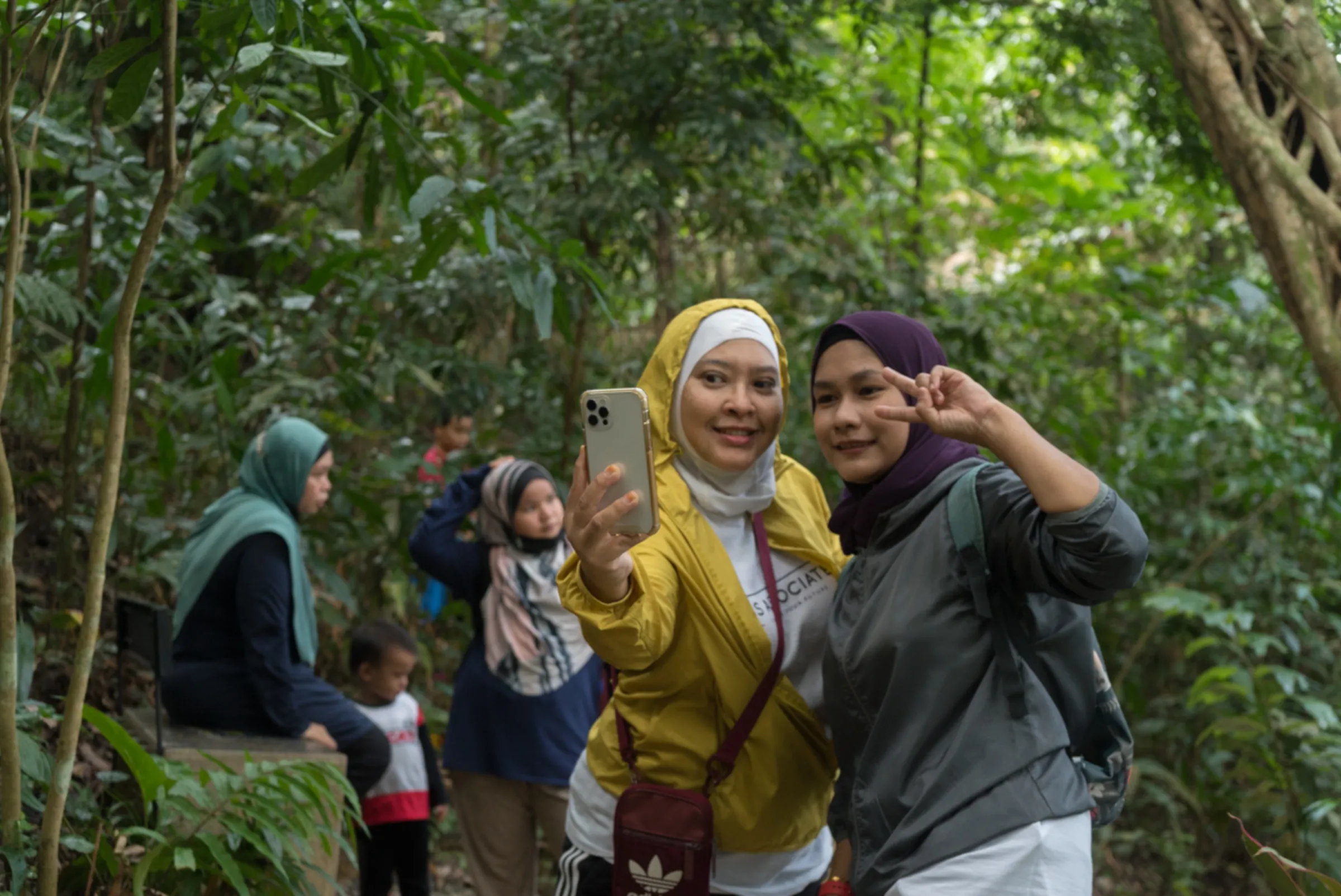 Visitors to Kuala Lumpur's Taman Tugu tropical forest park take a break