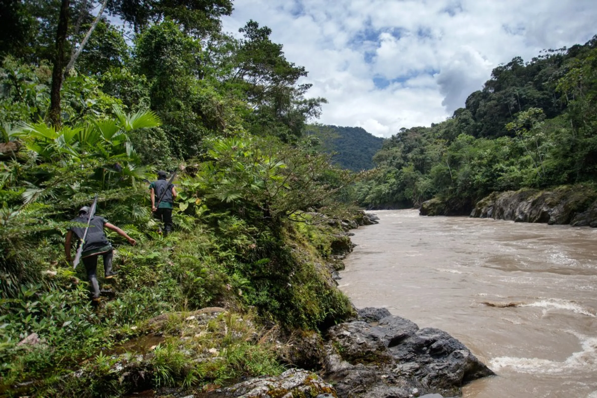 Members of the Cofan indigenous guard patrol the banks of the Aguarico River near their rainforest village of Sinangoe in northern Ecuador, on April 21, 2022. Patrols can take up to two weeks and are carried out regularly