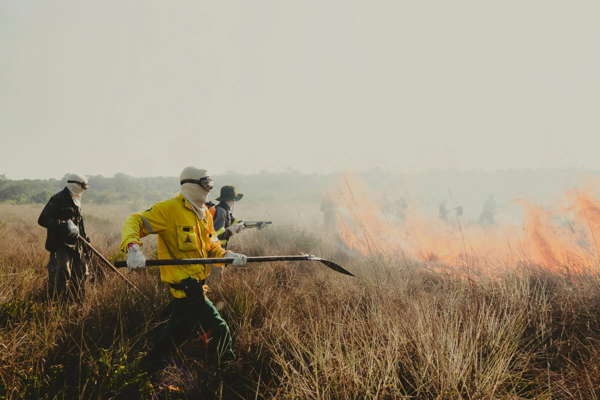Firefighters from the Bridada de Alter use fire management techniques to protect areas of ecological interest in Alter do Chao, Para State, Brazil. August 1, 2024. Brigada de Alter/Handout via Thomson Reuters Foundation