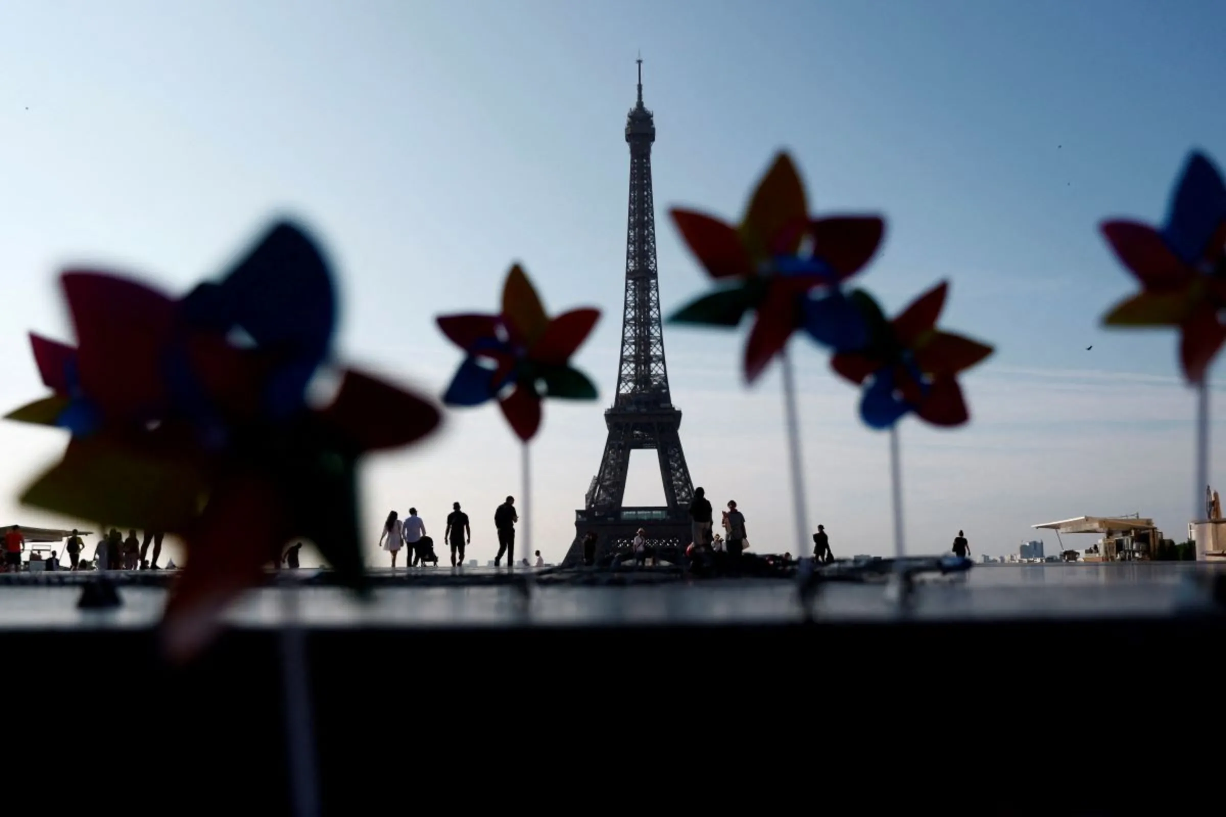 Decorative windmills installed by activists with Glasgow Actions Team and 350.org are seen on the Trocadero Square in front of the Eiffel Tower to welcome world leaders on the eve of the Summit for a New Global Financial Pact, in Paris, France, June 21, 2023