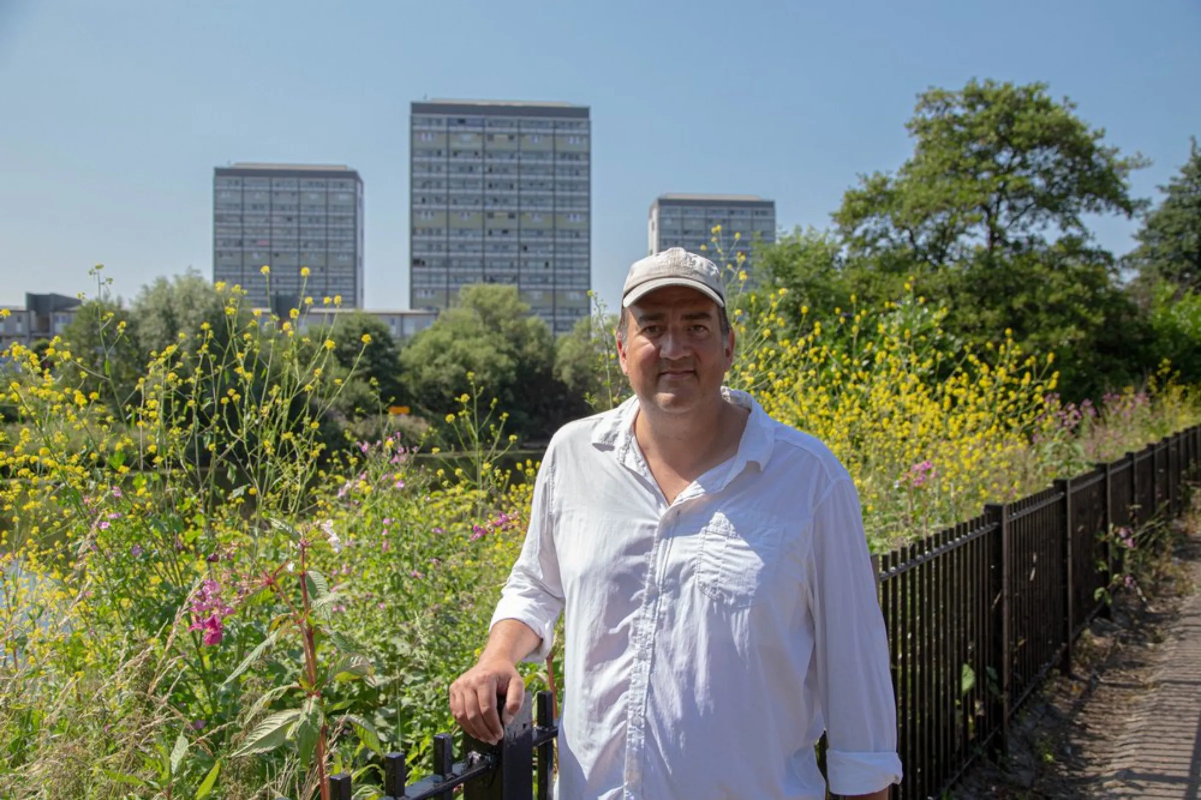 John Maslen, of social enterprise Greenspace Scotland, pauses near the banks of the River Clyde in Glasgow, United Kingdom, July 20, 2021. The Clyde’s waters could be used to provide low-carbon energy to Glasgow's homes and businesses, energy experts say