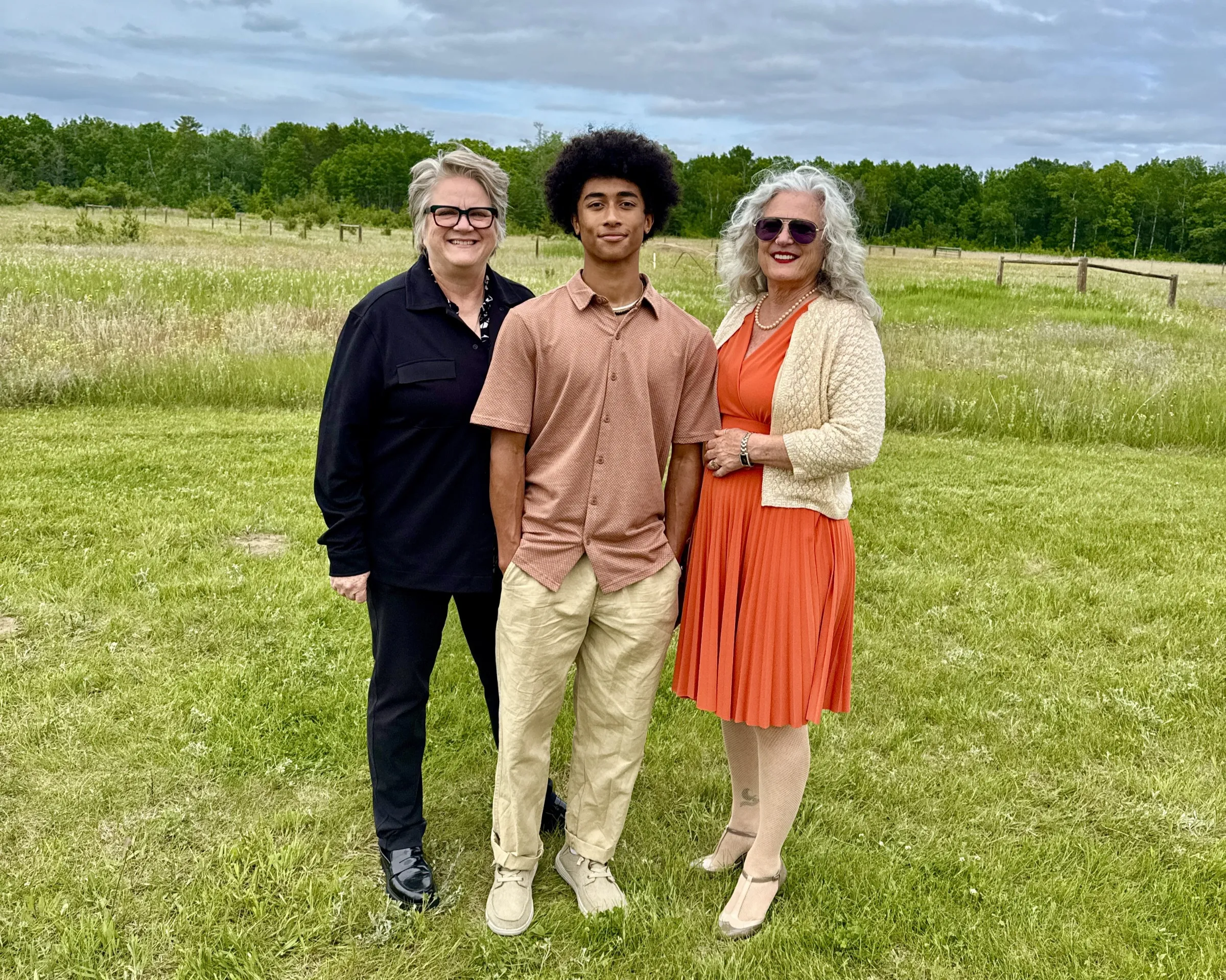 Photo shows Nancy (left) and Laura Lyons (right) with their son Merrick Lyons (middle). Nancy Lyons/Handout via Thomson Reuters Foundation.