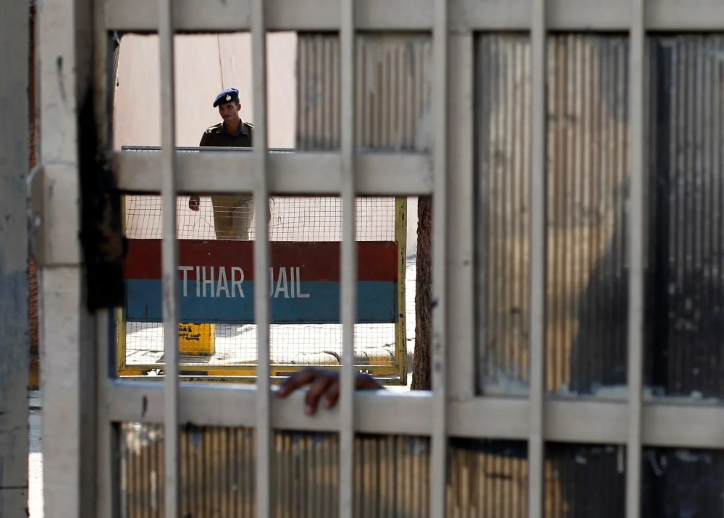 A policeman walks inside the Tihar Jail in New Delhi March 11, 2013