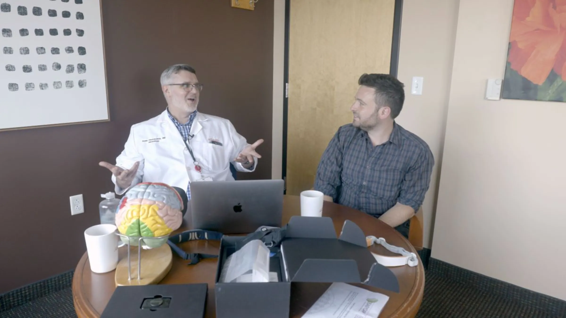 Sean Pauzauskie, medical director The Neurorights Foundation, discusses brainwave-reading tech with Context report Avi Asher-Schapiro in the U.S. state of Colorado on August 5, 2024. Thomson Reuters Foundation/Jacob Templin