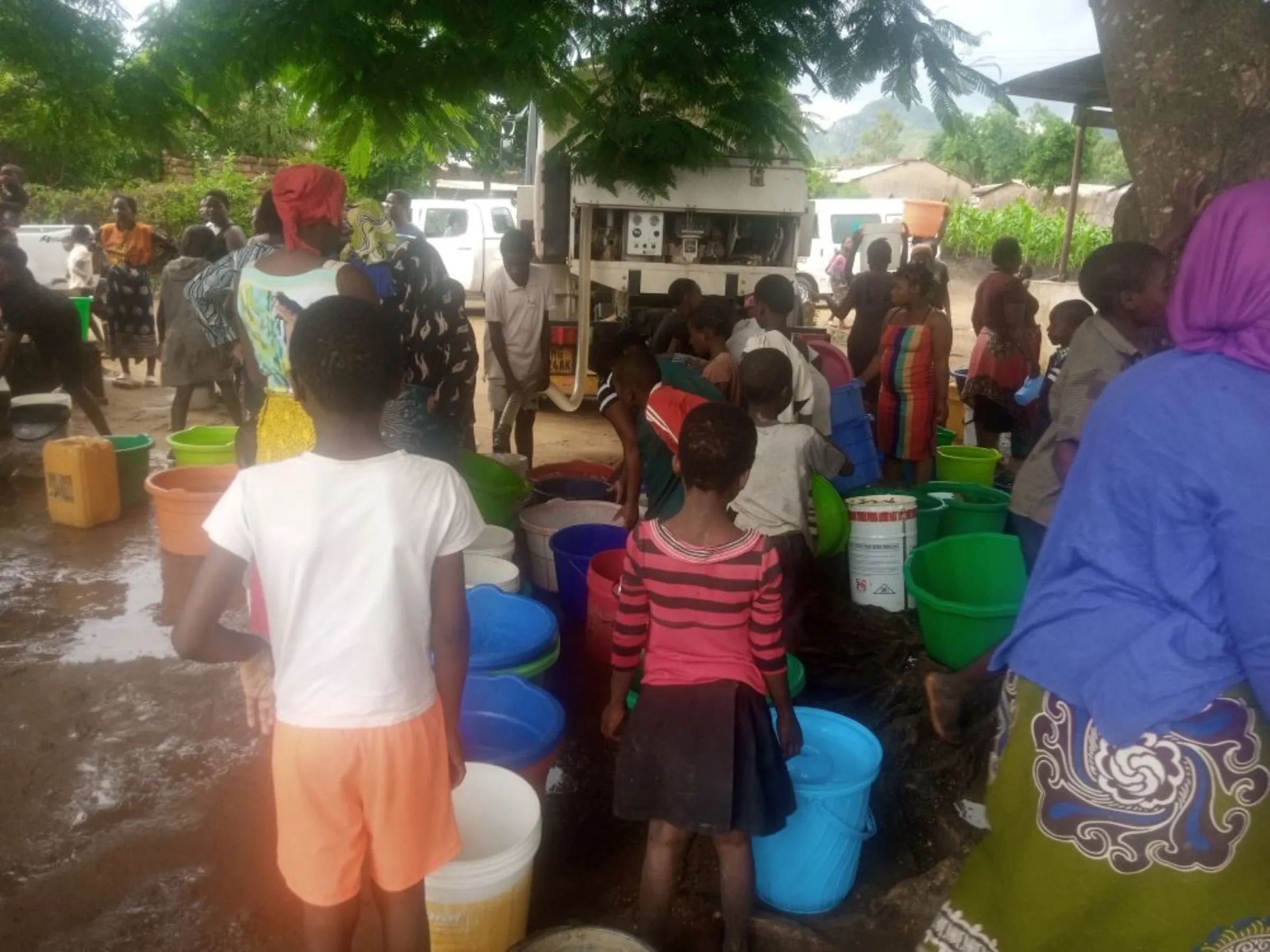 Residents in Makhetha Township draw water from Kiosks after weeks of no running water, Malawi. January 11, 2023