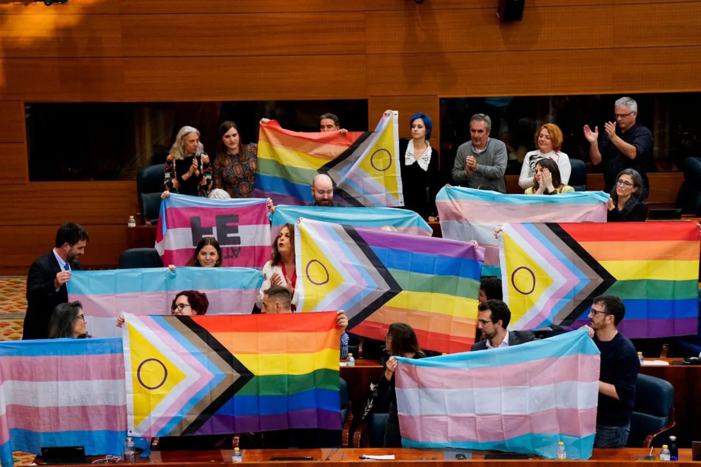 People react during a vote to pass a proposal to strip back protections for transgender people at the regional parliament in Madrid, Spain, December 22, 2023. REUTERS/Ana Beltran