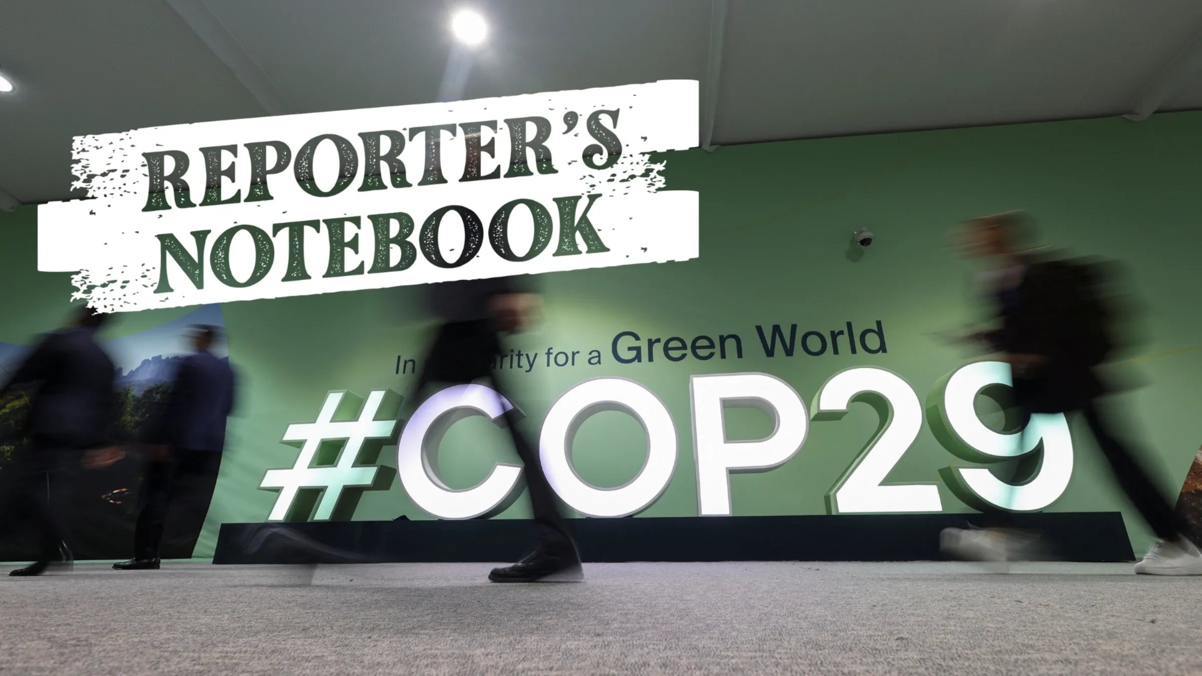 People walk past a COP29 logo during the United Nations Climate Change Conference (COP29), in Baku, Azerbaijan November 14, 2024. REUTERS/Murad Sezer