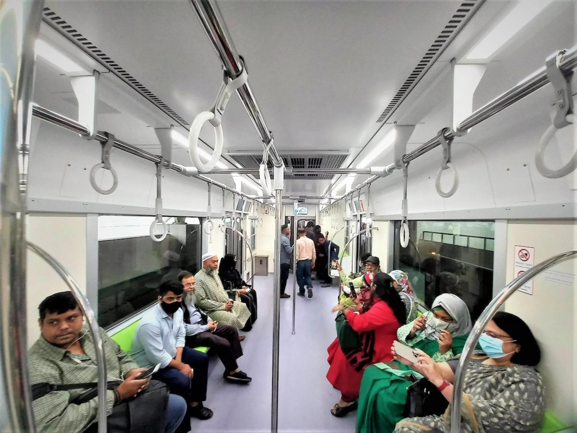 Passengers ride the new metro rail in Dhaka, Bangladesh, February 1, 2023. Thomson Reuters Foundation/Md. Tahmid Zami