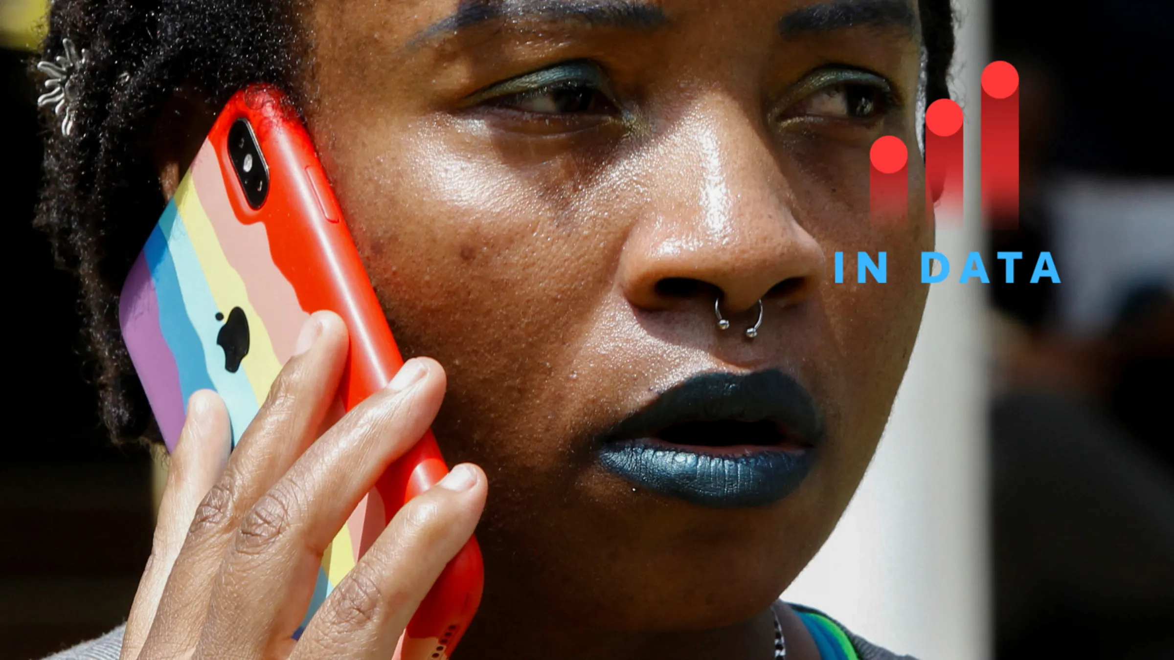 A Kenyan activist uses a phone with a Pride cover during the Badilika festival to celebrate the LGBT rights Nairobi, Kenya June 11, 2023. REUTERS/Monicah Mwangi