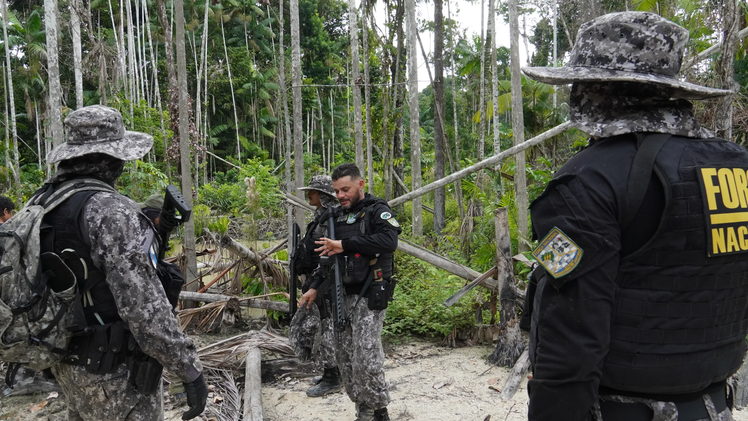 Public security forces patrol a suspected illegal mining site in the Munduruku Indigenous Reserve, Brazil, Jan 9, 2025. Thomson Reuters Foundation/Dan Collyns