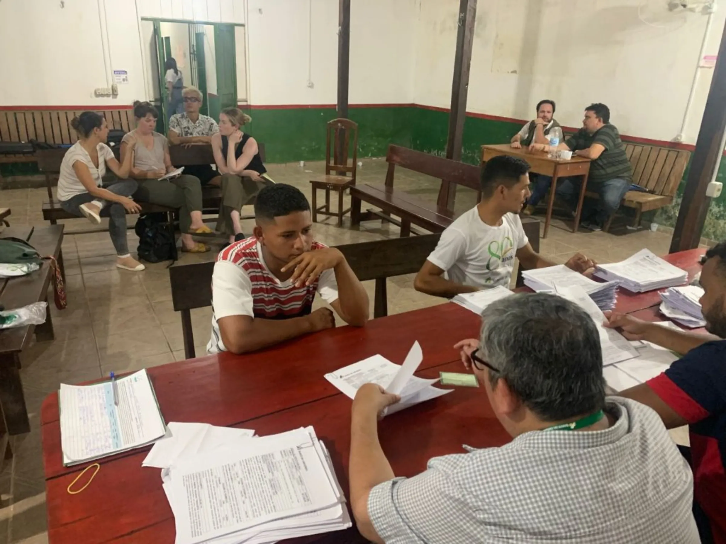 Workers from Brazilian non-profit Conexsus collect signatures from local producers in Portel, in the Amazon state of Para, Brazil, in 2022, while setting up a production contract.Conexsus/Handout Via Thomson Reuters Foundation