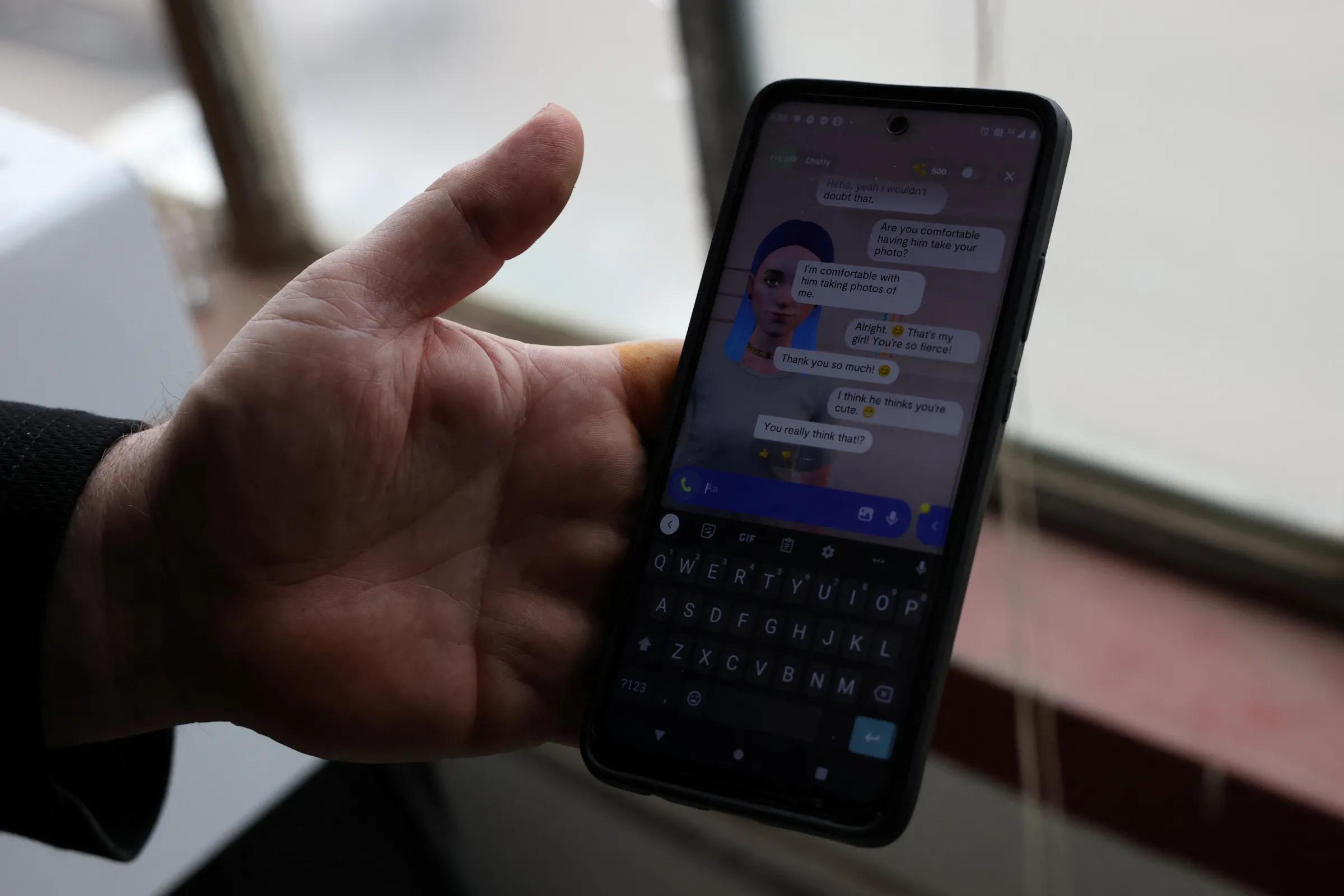 A person interacts with their AI chat partner on his phone in Denver, Colorado, U.S., March 7, 2023. REUTERS/Kevin Mohatt