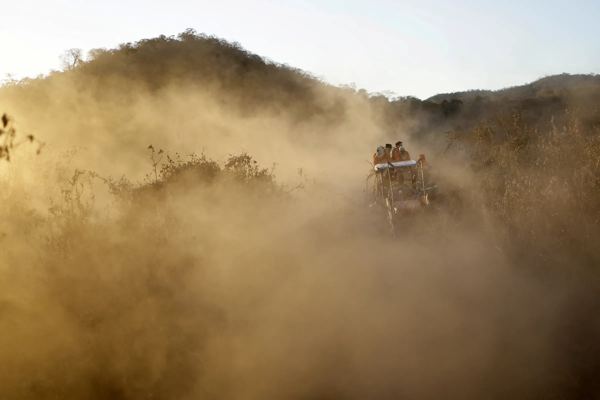 Volunteer firefighter members of the Alto Pantanal Brigade are seen on a tractor as they work to extinguish a fire rising in the Pantanal, in Corumba, Mato Grosso do Sul state, Brazil, June 14, 2024. REUTERS/Ueslei Marcelino