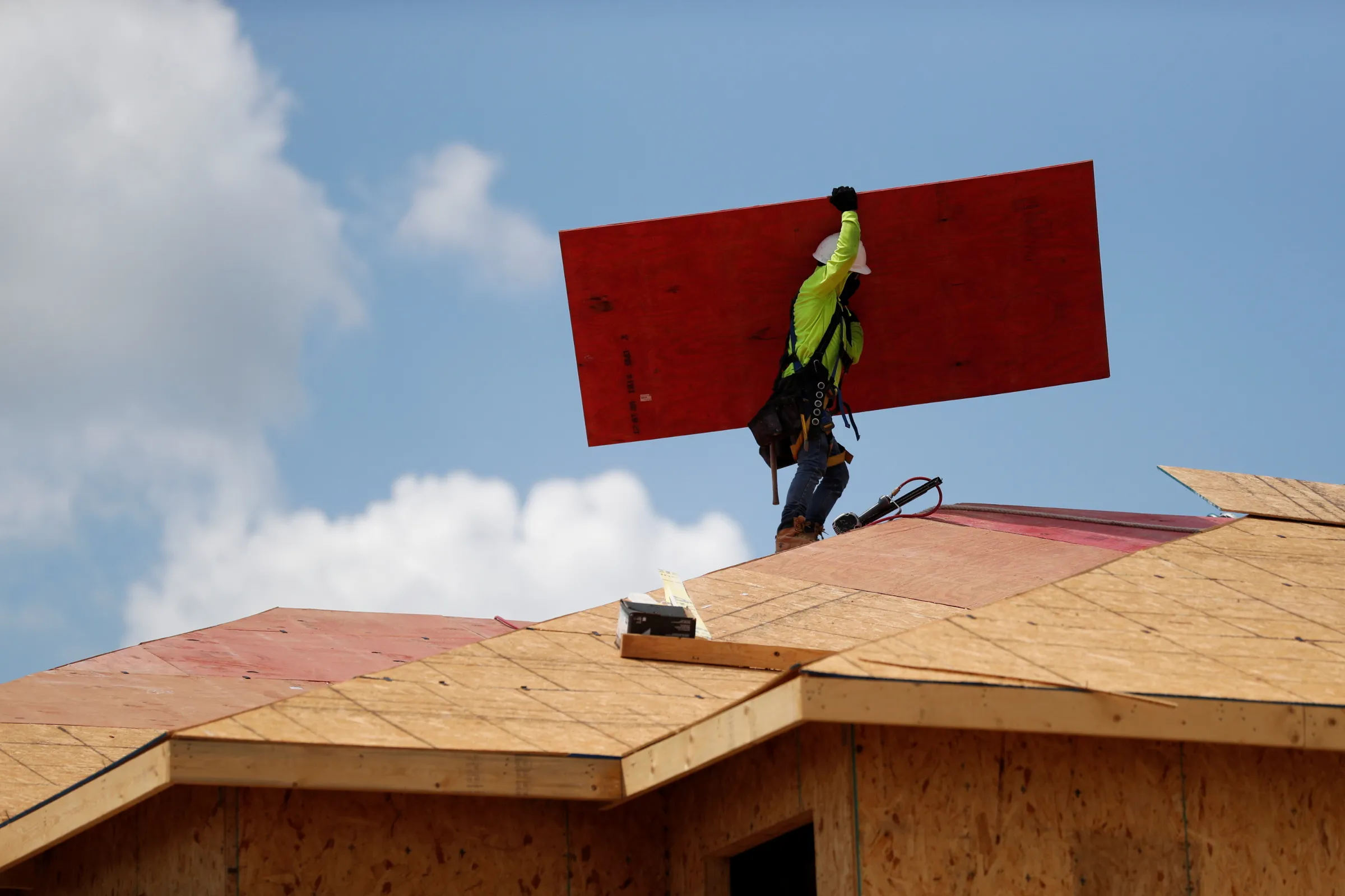 A carpenter works on building new townhomes that are still under construction in Tampa, Florida, U.S., May 5, 2021. REUTERS/Octavio Jones