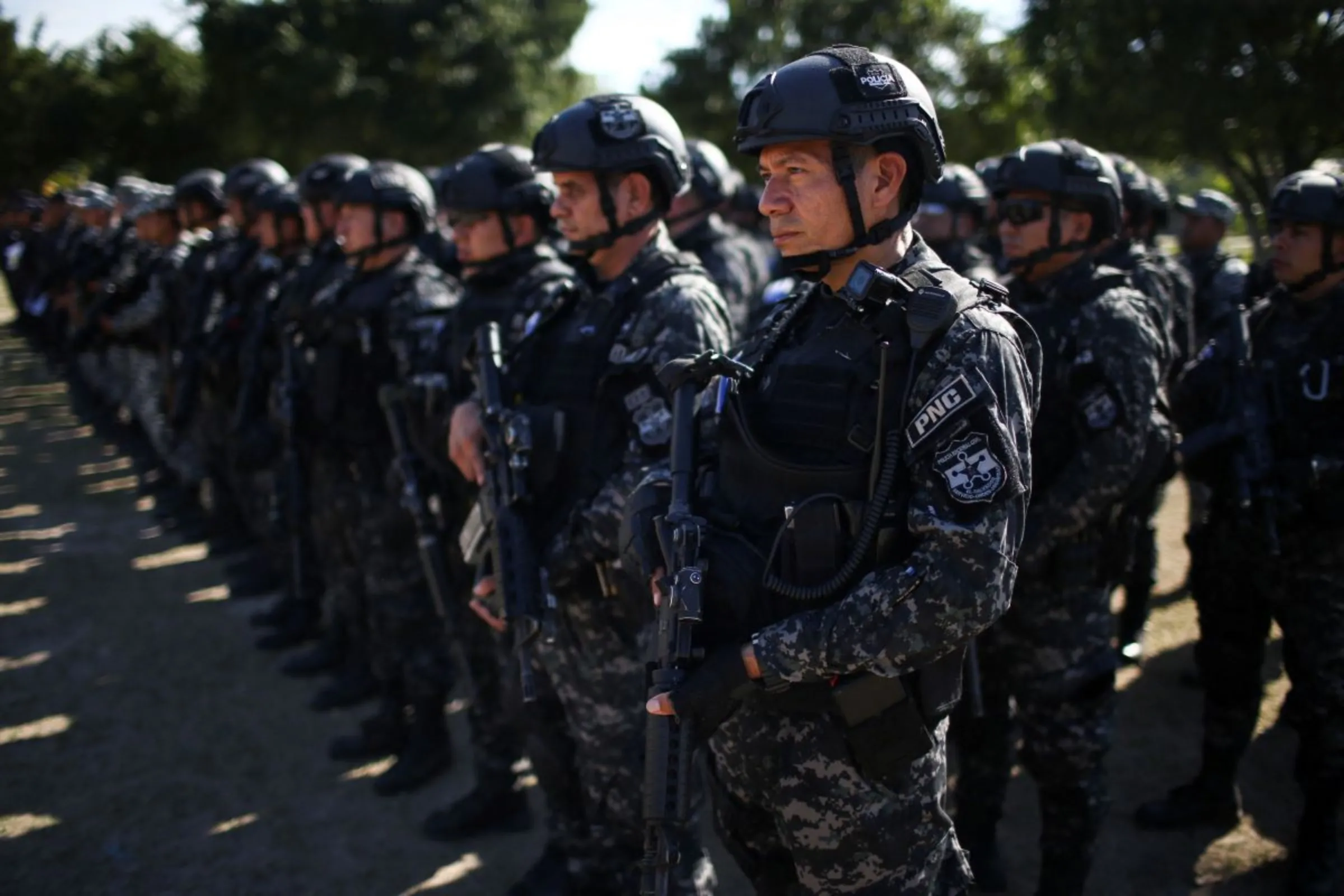 Policemen prepare for an anti-gang patrol following a year-long state of emergency against gangs, in Soyapango, El Salvador March 24, 2023. REUTERS/Jose Cabezas