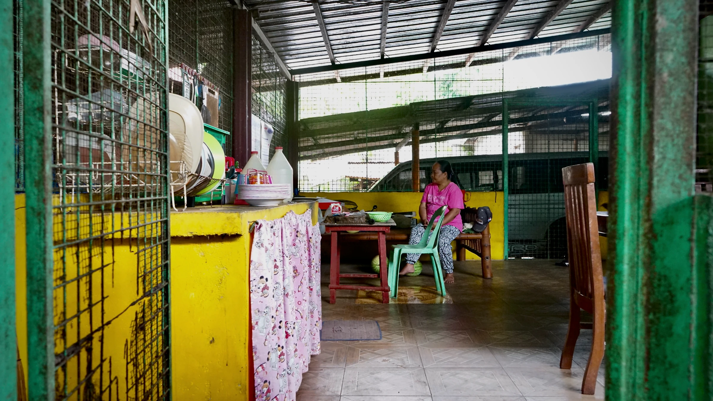 Sam Dela Cruz’s mother, Roselyn, blankly stares across the kitchen, which has become a usual habit in the years since her son’s demise. Sultan Kudarat, Philippines, June 4, 2025. Thomson Reuters Foundation/Raizza Bello