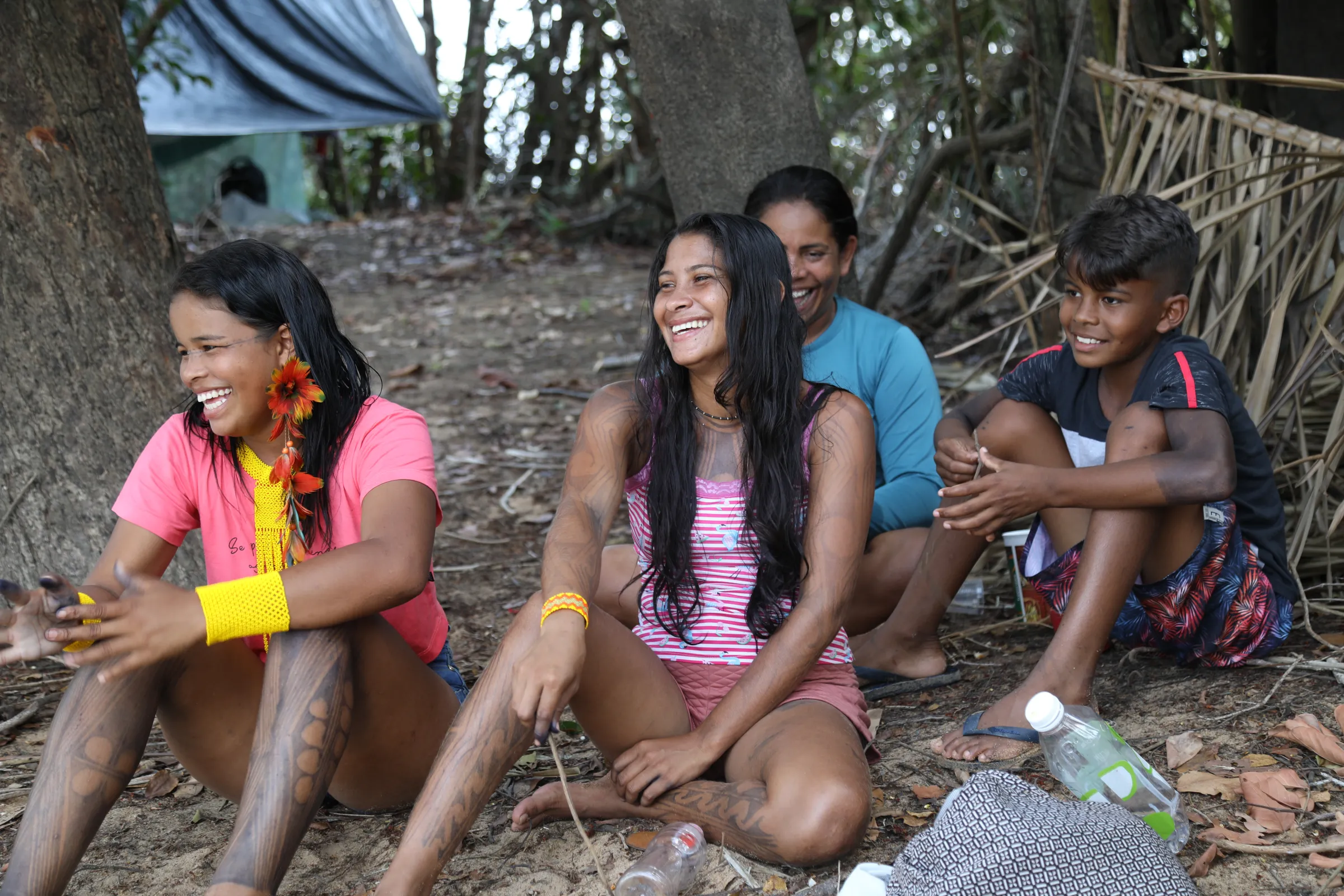 An indigenous Juruna family shares a joke near the Volta Grande in the River Xingu, Pará, Brazil, September 12, 2022. Thomson Reuters Foundation/Dan Collyns