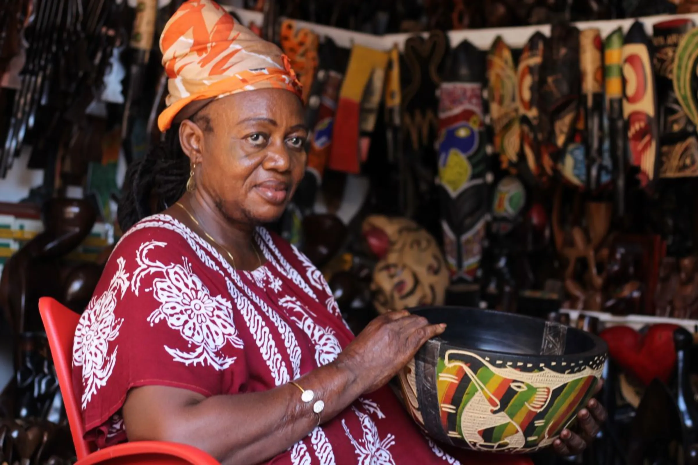 Mathilda Arabaprah displays woodwork at her store in Accra Arts and Crafts Centre in Ghana on June 12, 2023