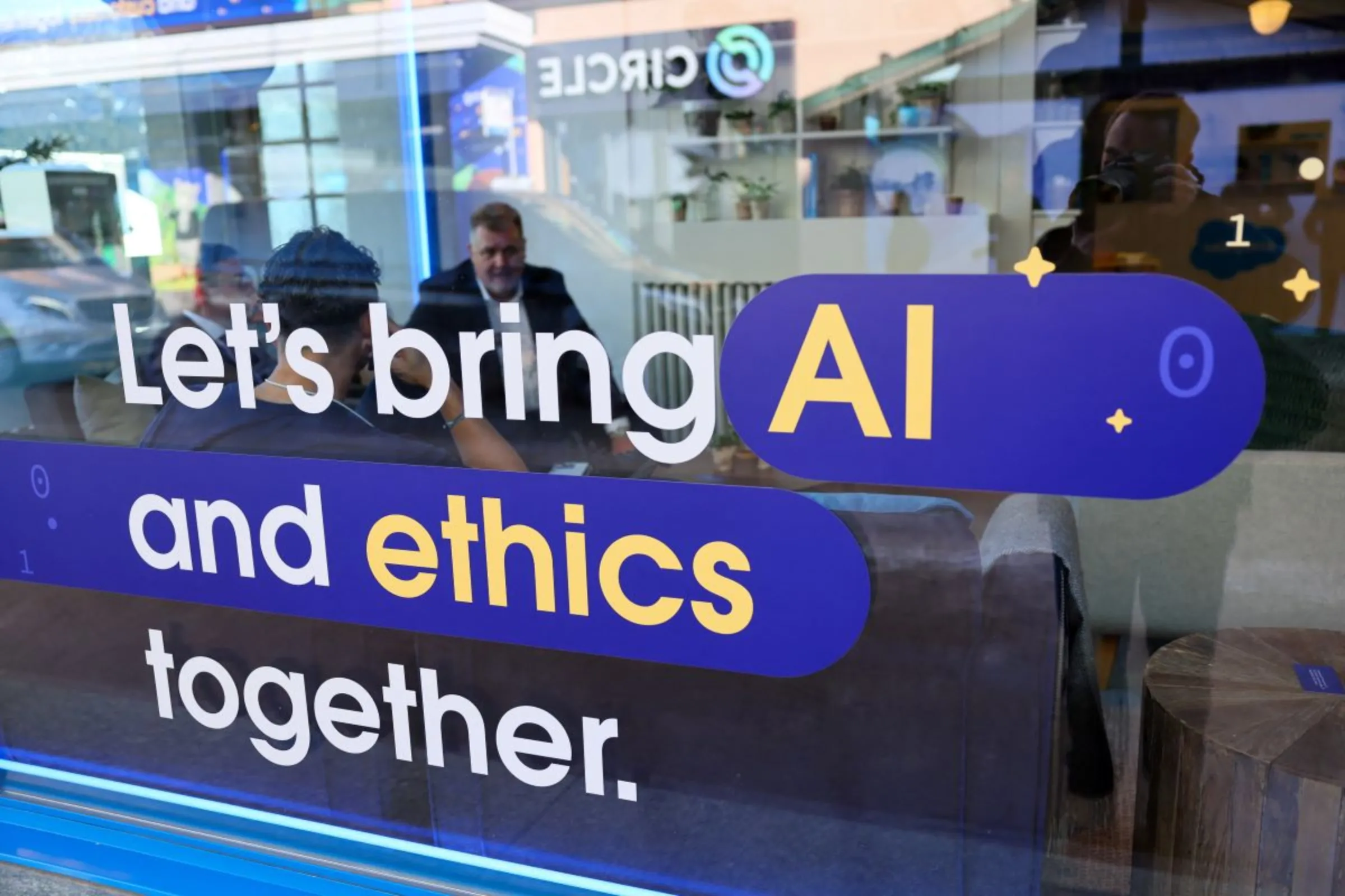 Salesforce's slogan related to Artificial Intelligence (AI) is displayed on a window during the 54th annual meeting of the World Economic Forum in Davos, Switzerland, January 16, 2024. REUTERS/Denis Balibouse