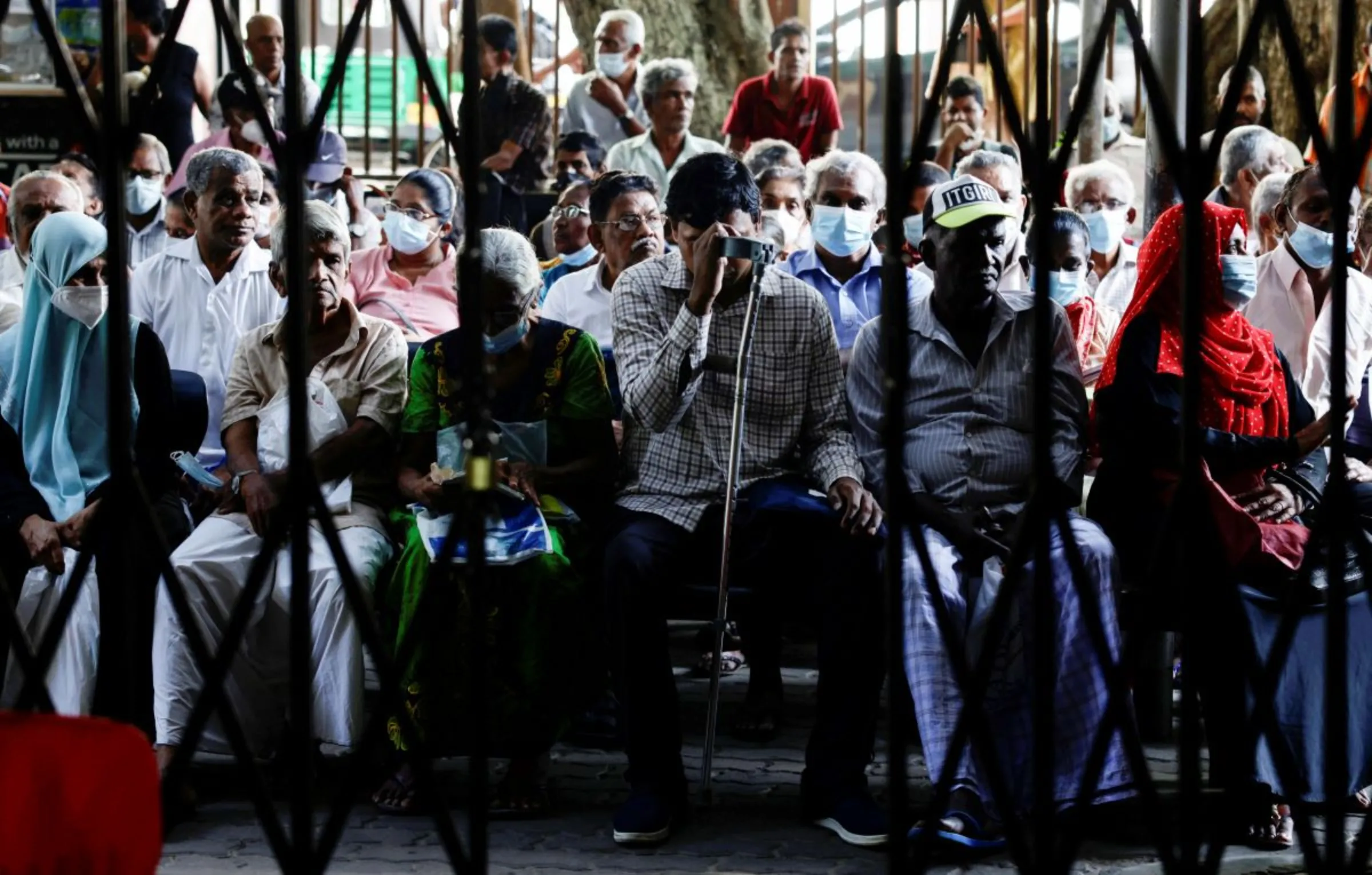 Patients wait for doctors near a waiting area at a hospital during the general strike, in Colombo, Sri Lanka March 15, 2023. REUTERS/Dinuka Liyanawatte