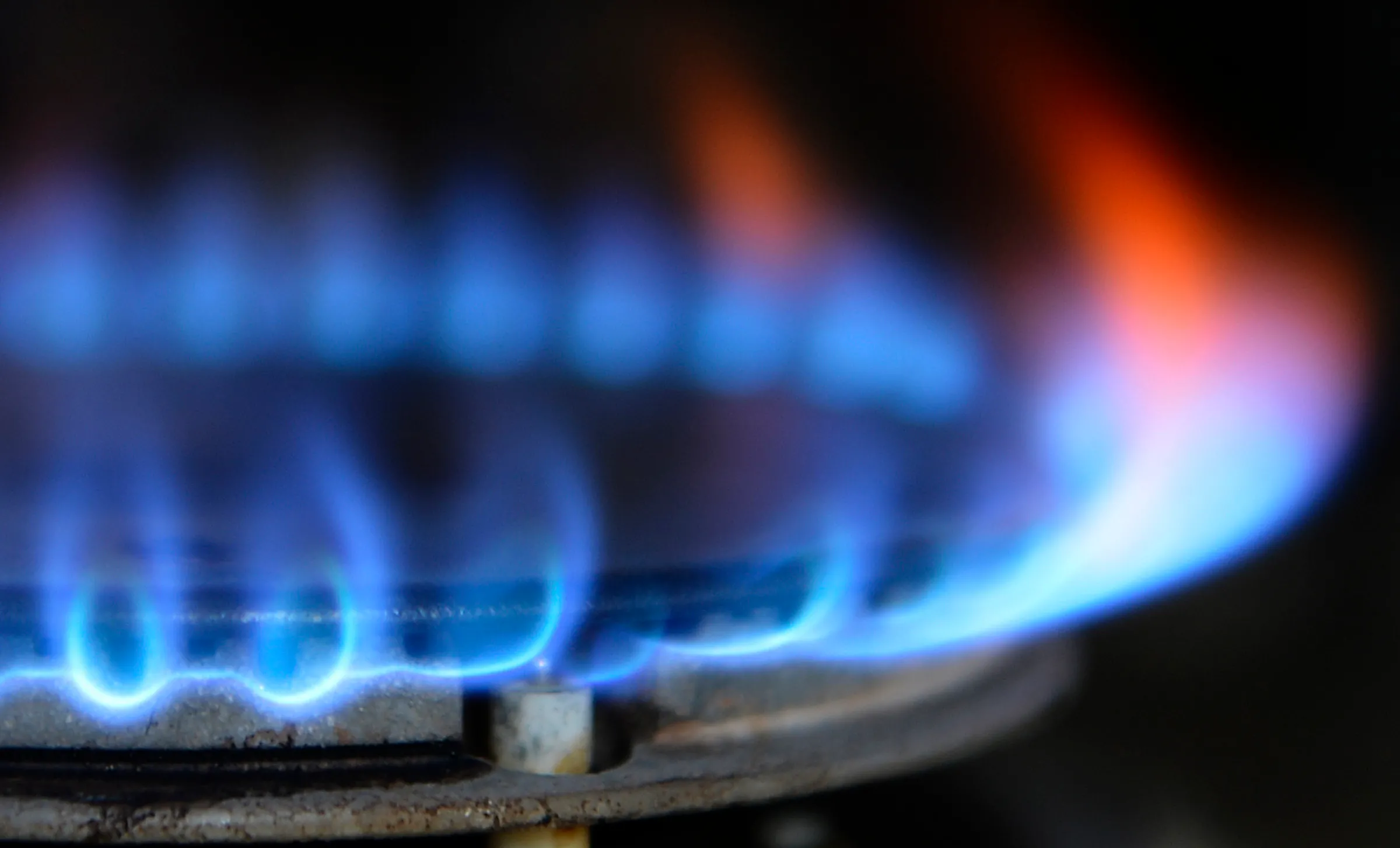 Blue and orange flames from a gas cooker