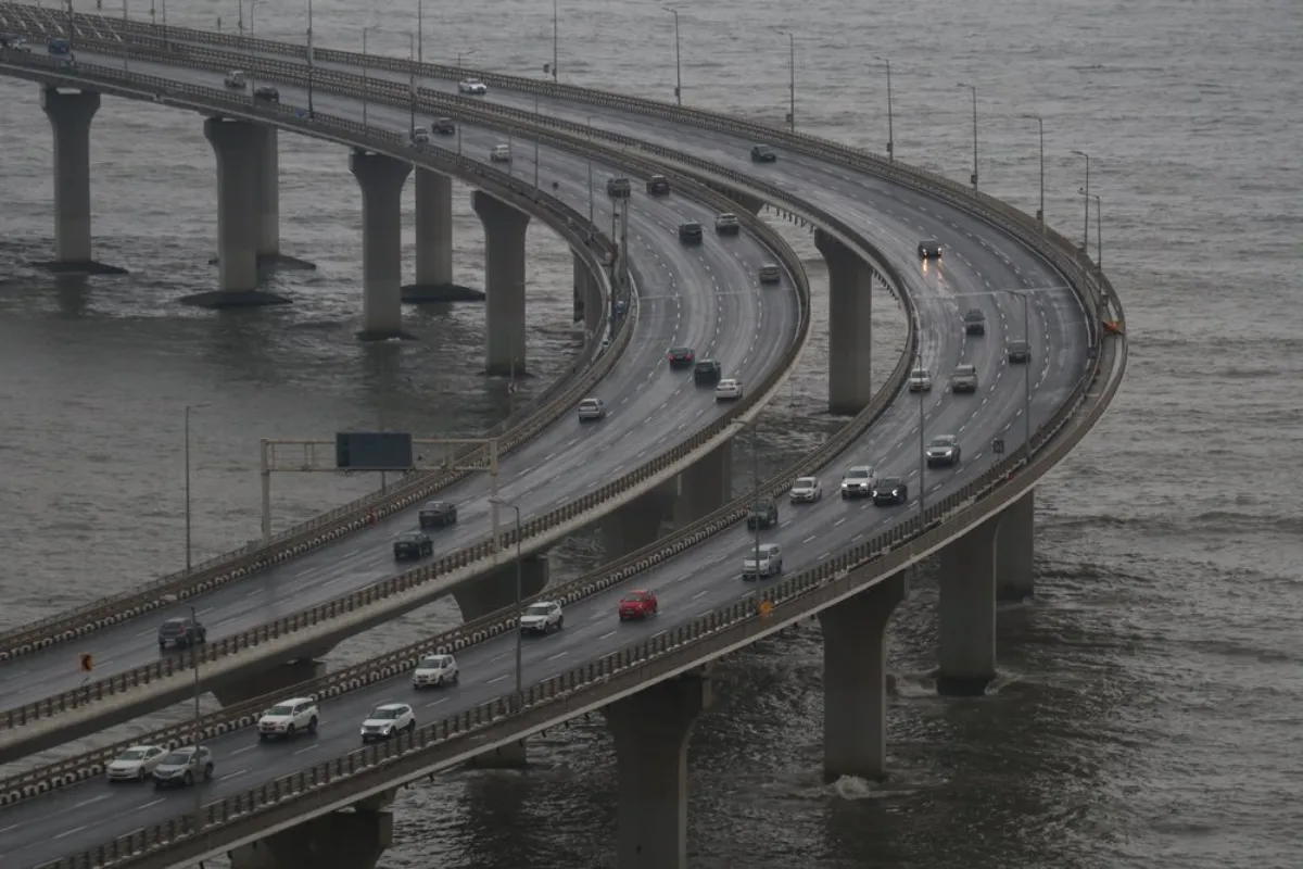 A view of cars on a highway elevated over the Arabian Sea in Mumbai, India, September 12, 2021