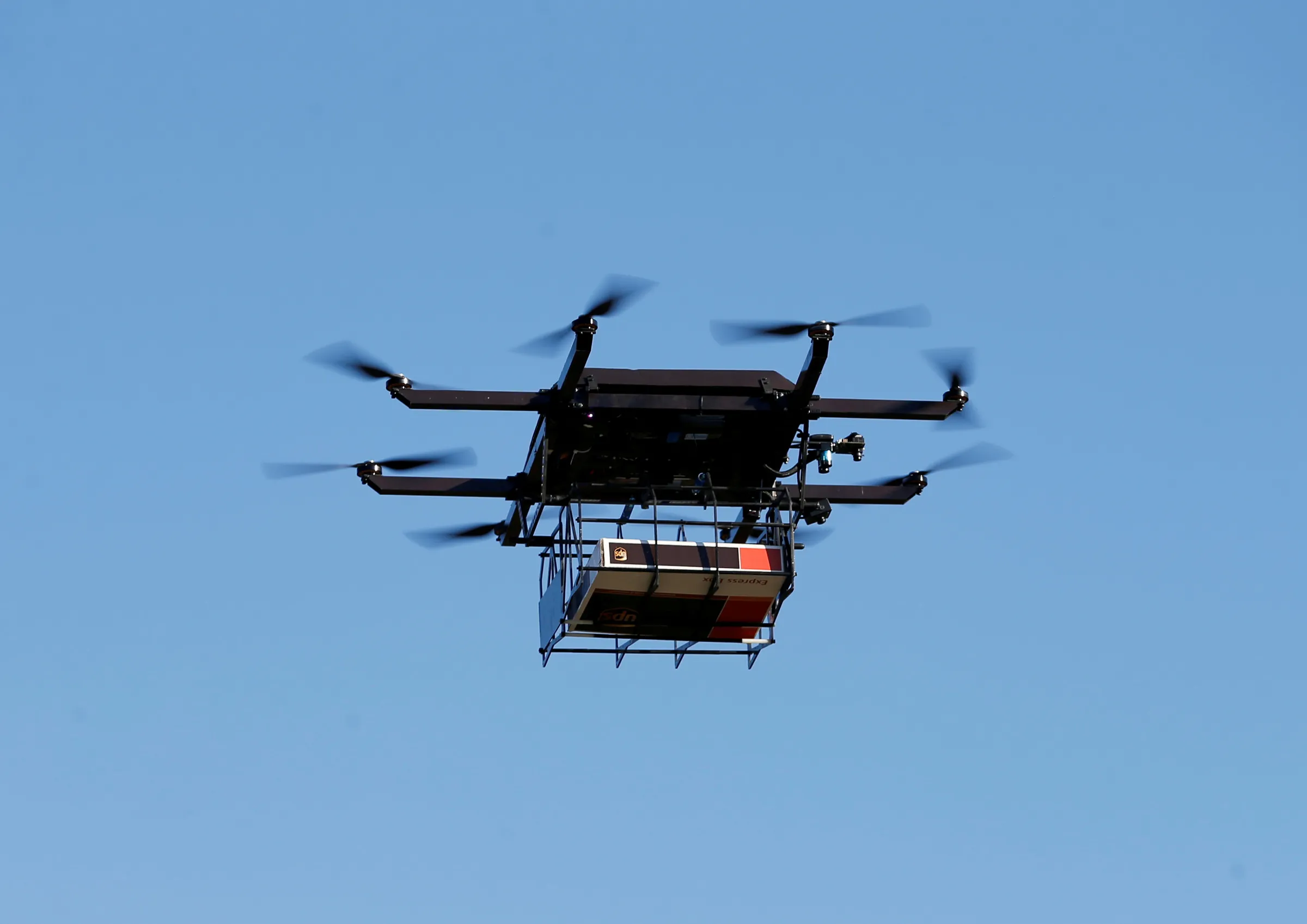 A drone demonstrates delivery capabilities from the top of a UPS truck during testing in Lithia, Florida, U.S. February 20, 2017