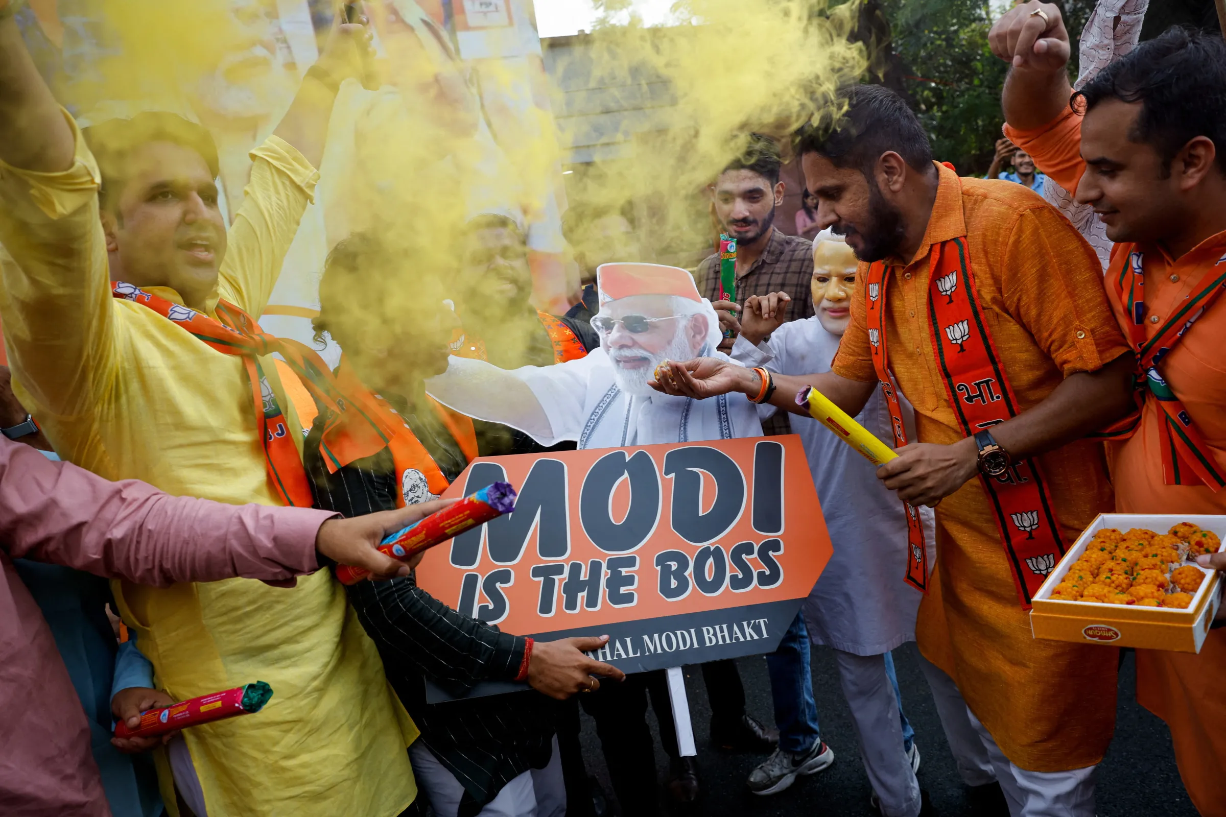 Bharatiya Janata Party (BJP) supporters celebrate outside BJP headquarters, on the day of the general election results, in New Delhi, India, June 4, 2024. REUTERS/Adnan Abidi