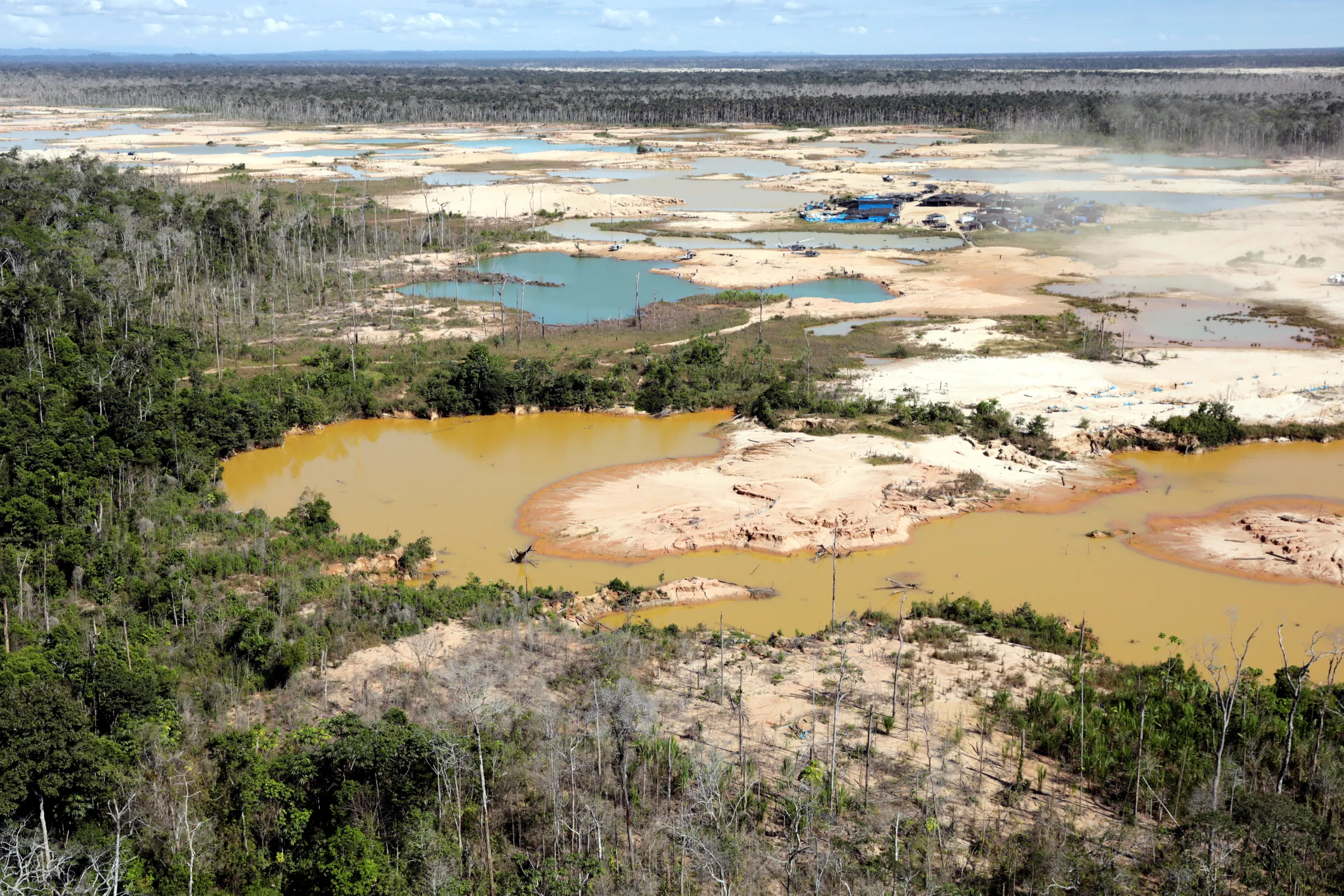 An aerial view shows an illegal gold mining camp as seen during Peru's President Martin Vizcarra's visit to Madre de Dios, Peru, May 17, 2019. REUTERS/Guadalupe Pardo